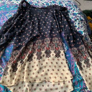 Sheer flowy navy top with print